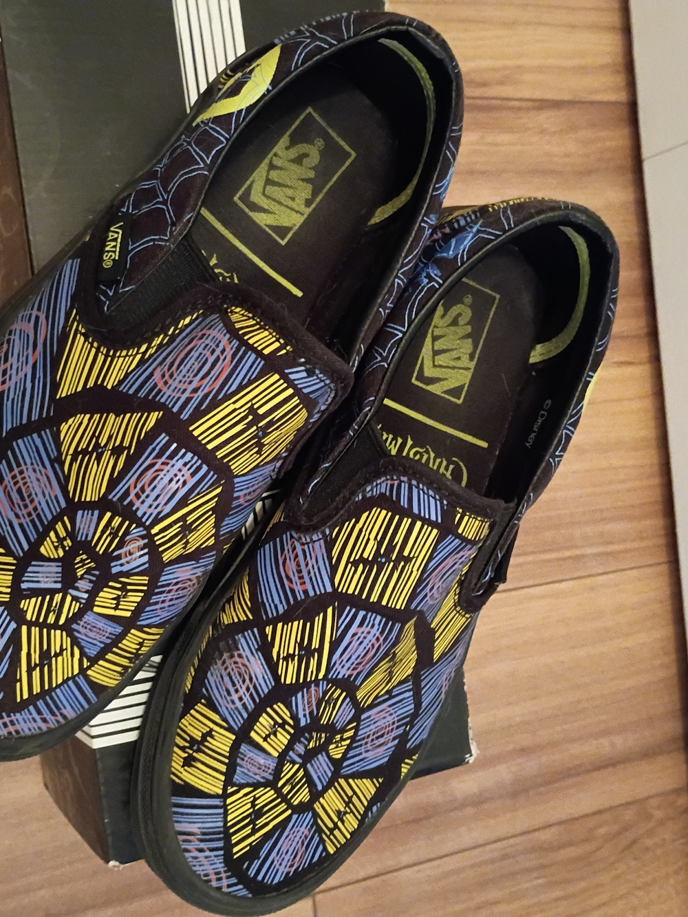 Vans Kids Slip-On Sneakers in Yellow, Blue & Black Spiderweb Motif